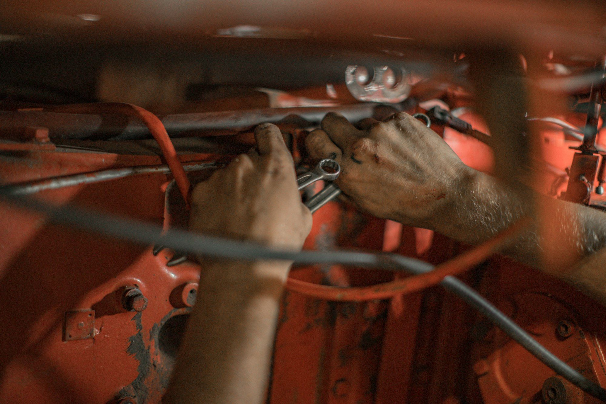 Hands working on car wiring